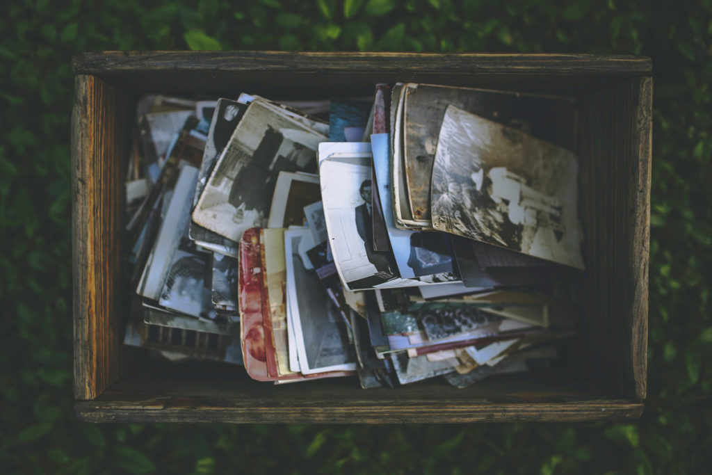 box filled with a stack of old photos