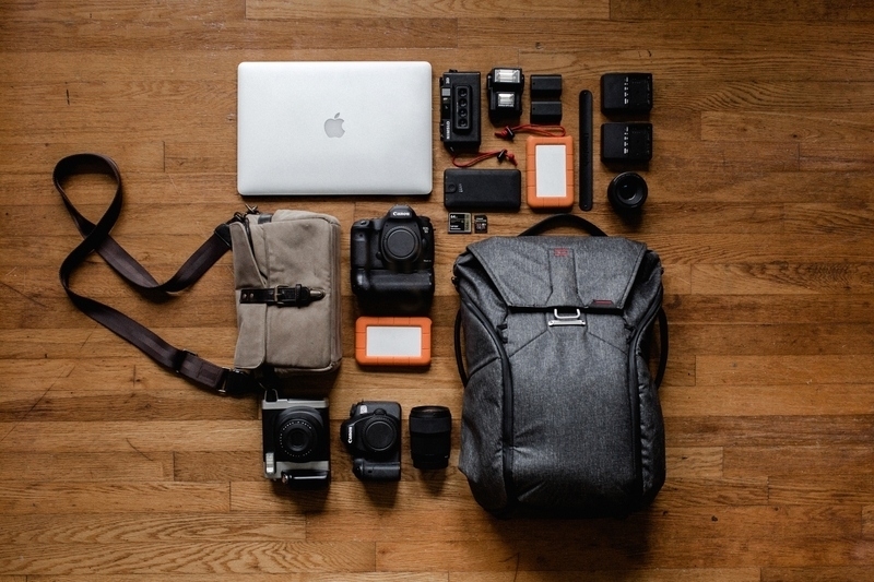 Photo equipment, laptop computer and portable external hard drives.