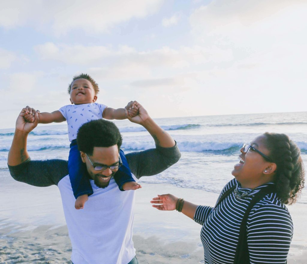 mother, father, toddler at the beach. family photo legacy