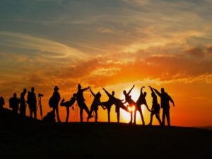 group-of-people-playing-sunset